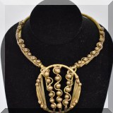 J090. Brass choker necklace with large brass pendant. - $38 